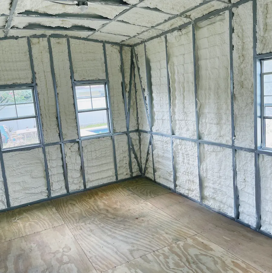 Closed-cell spray foam insulation applied to wall cavities in a residential project in Moss Bluff